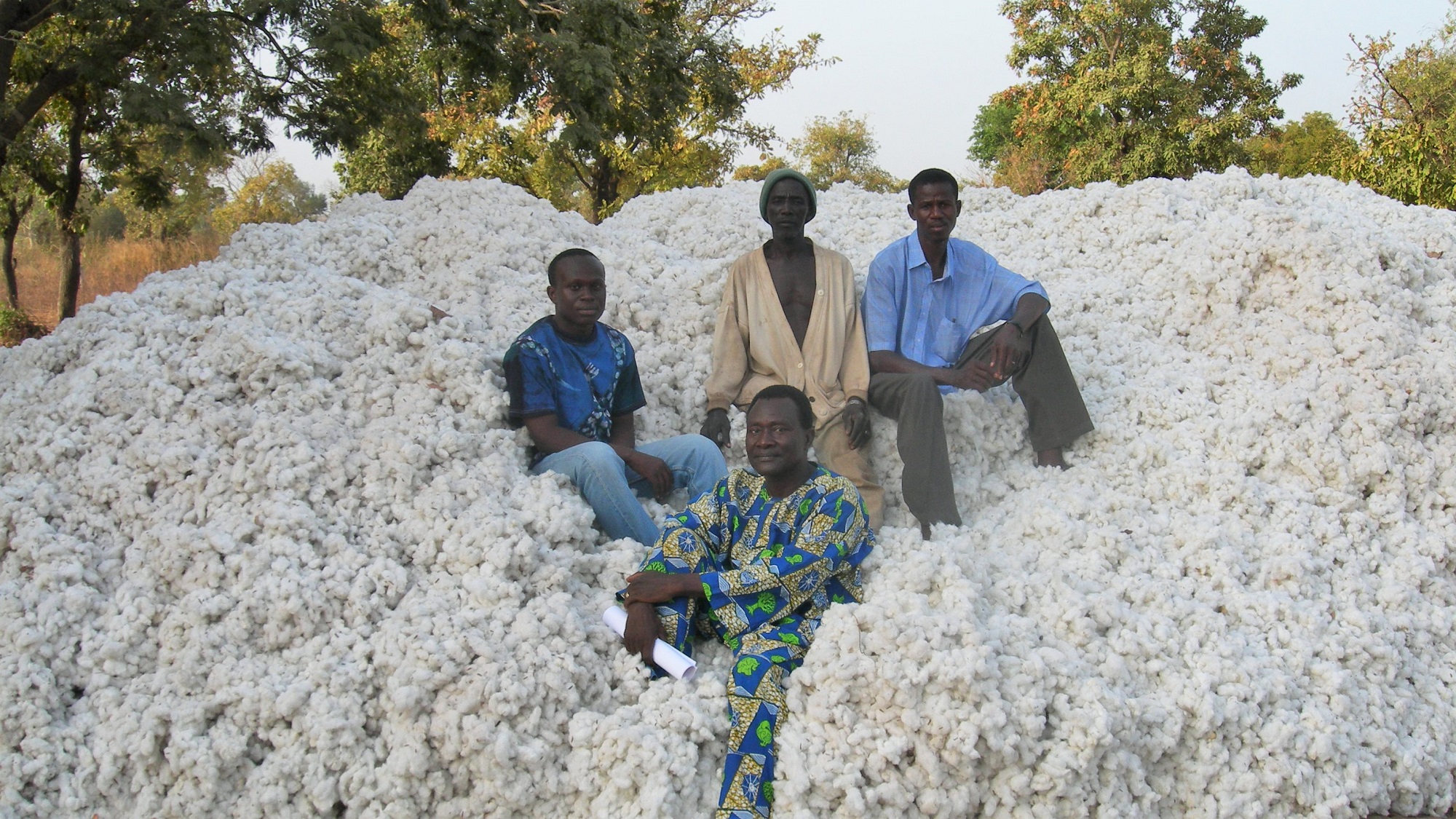 A cotton market in Benin, West Africa Organic cotton farmers at market in Benin