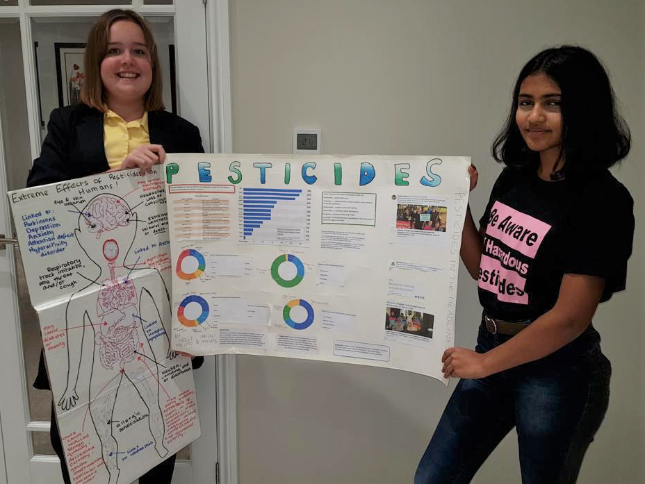 Anjali and Molly examine the pesticides in their food