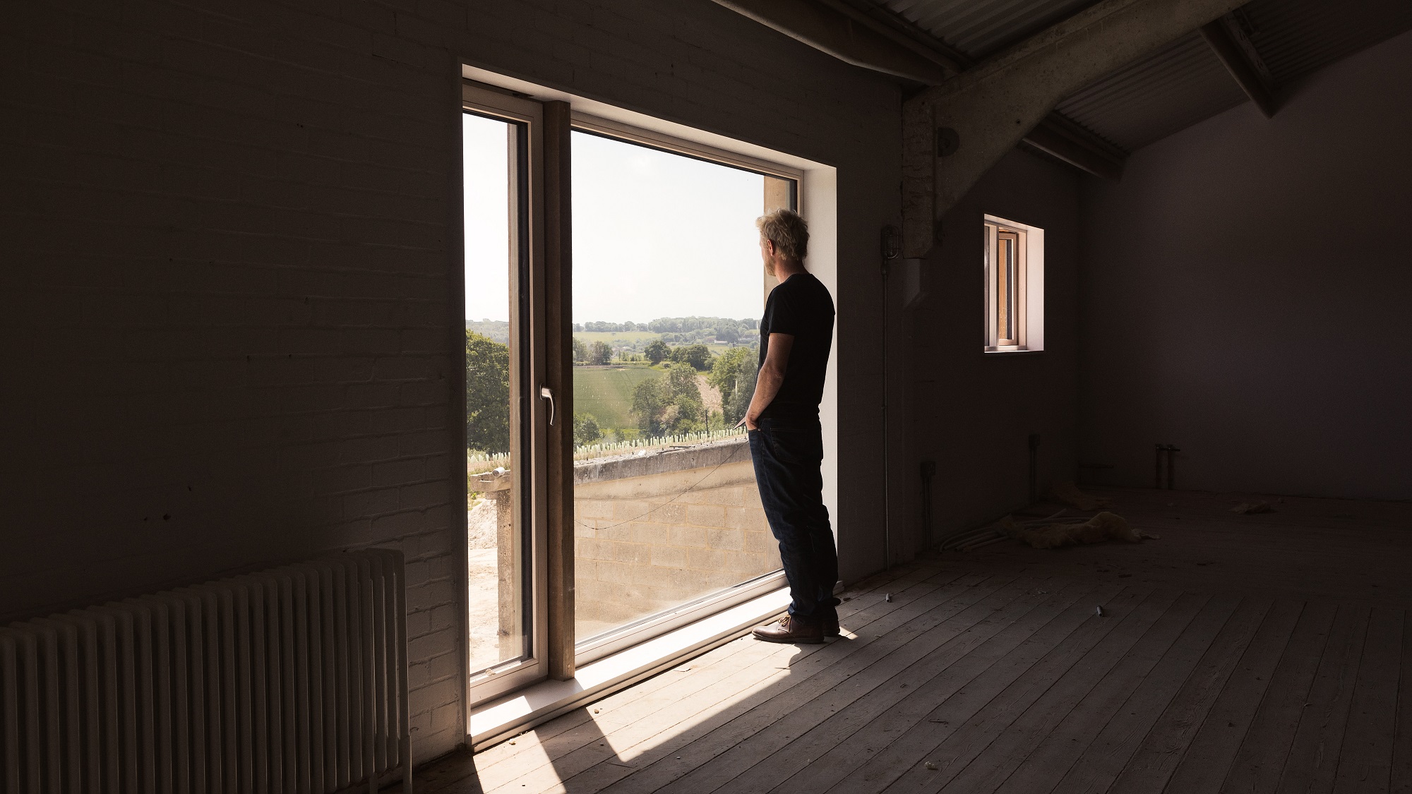 Ben looking over the vineyards at Tillingham