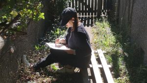 Taking the time to sketch pavement plants. Credit Anna Chapman Parker