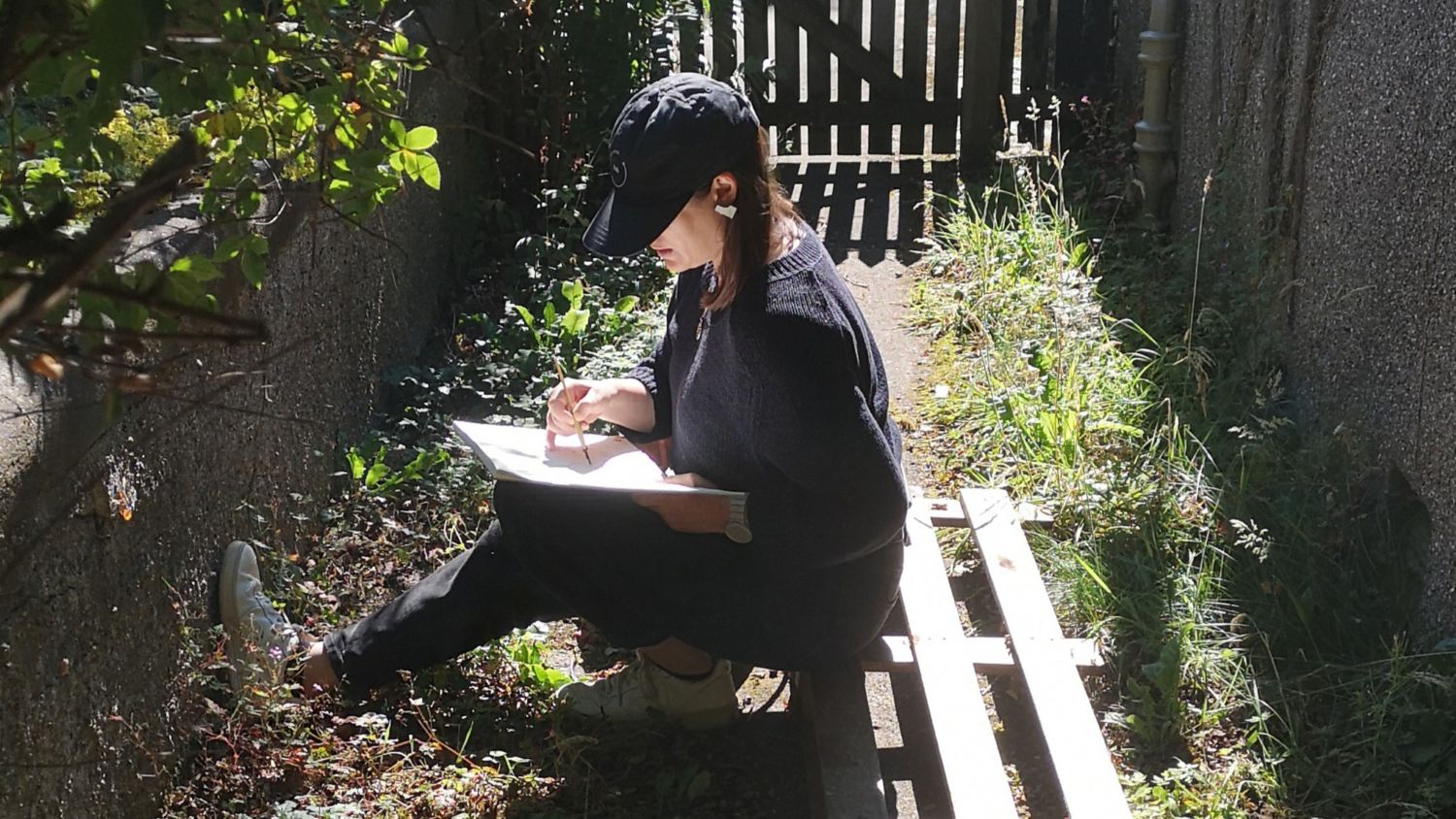 Taking the time to sketch pavement plants. Credit Anna Chapman Parker