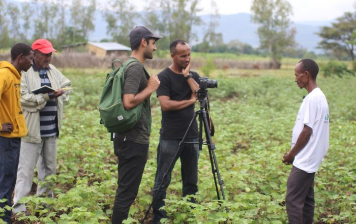 Filming with lead farmer, Mathios Mecho, who is successfully growing cotton without pesticides, in order to share learnings with fellow farmers. Credit PAN UK.