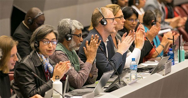 PAN delegates (third from left, Jayakumar, Keith Tyrell, Susan Haffmans, Sarojeni Rengam & seventh from left, Dr.Meriel Watts) seen applauding during the adoption of the 50th chemical listed under the Rotterdam Convention.